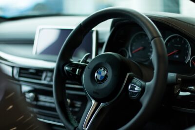 A car's steering wheel is pictured.