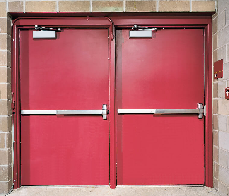 Picture of a Red Metal double door with exit device. It can be installed by fairfax locksmith, va. Call Keyway Lock Service