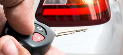 A transponder key is used to open a car.