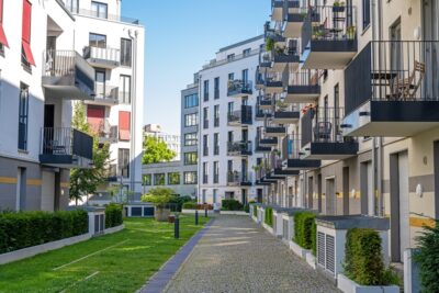 Apartment building are viewed from outside.