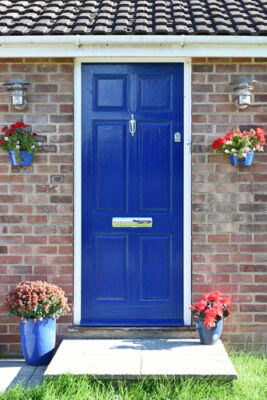 A home's blue door is pictured.