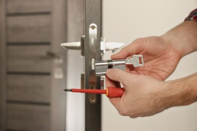 A locksmith rekeys a lock.